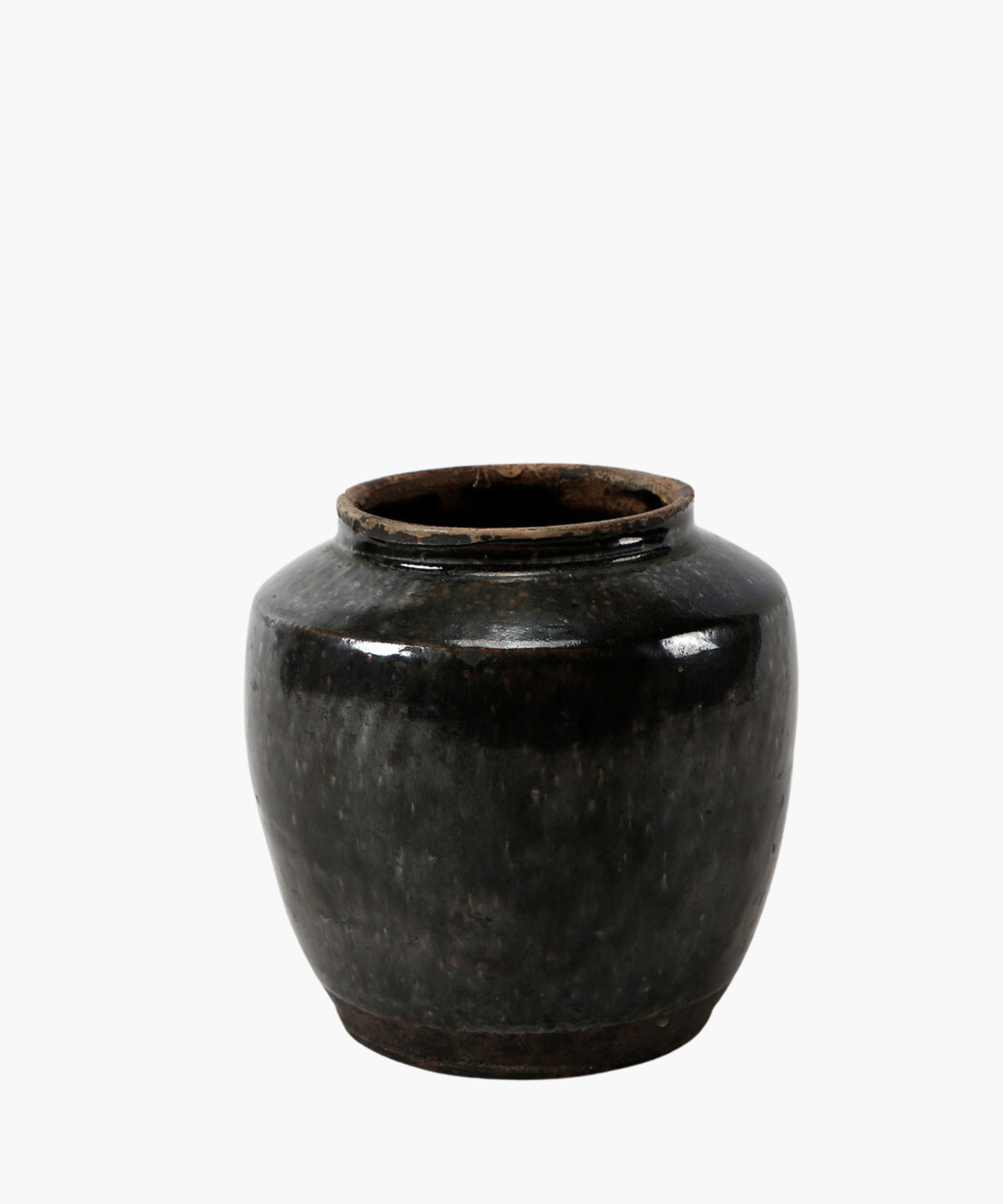 A ceramic one of a kind vintage oil pot with black glaze with a rounded body and a small opening at the top, conveying a classic and elegant tone.