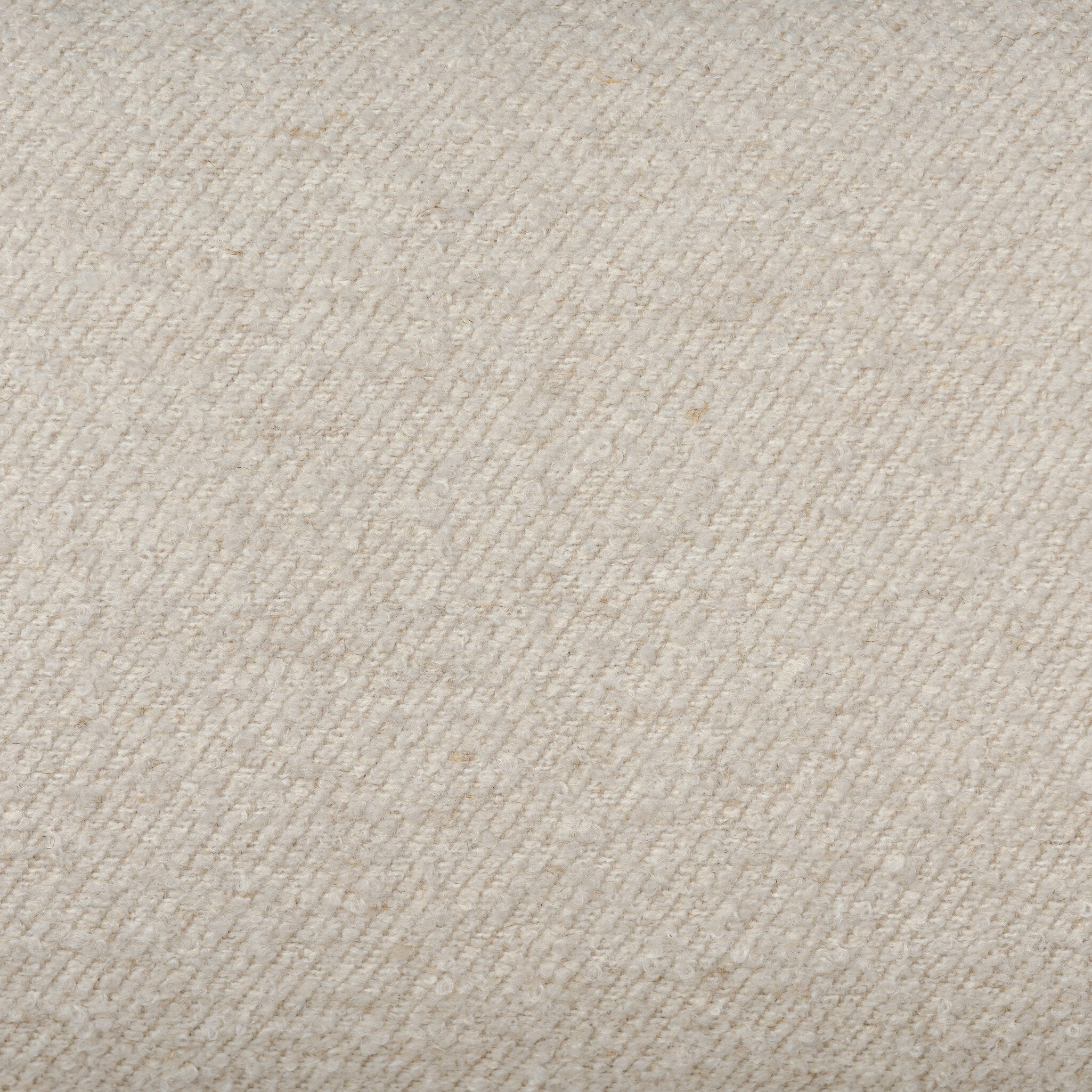 Close up of a bar stool with beige cushioned seat and backrest on a white background