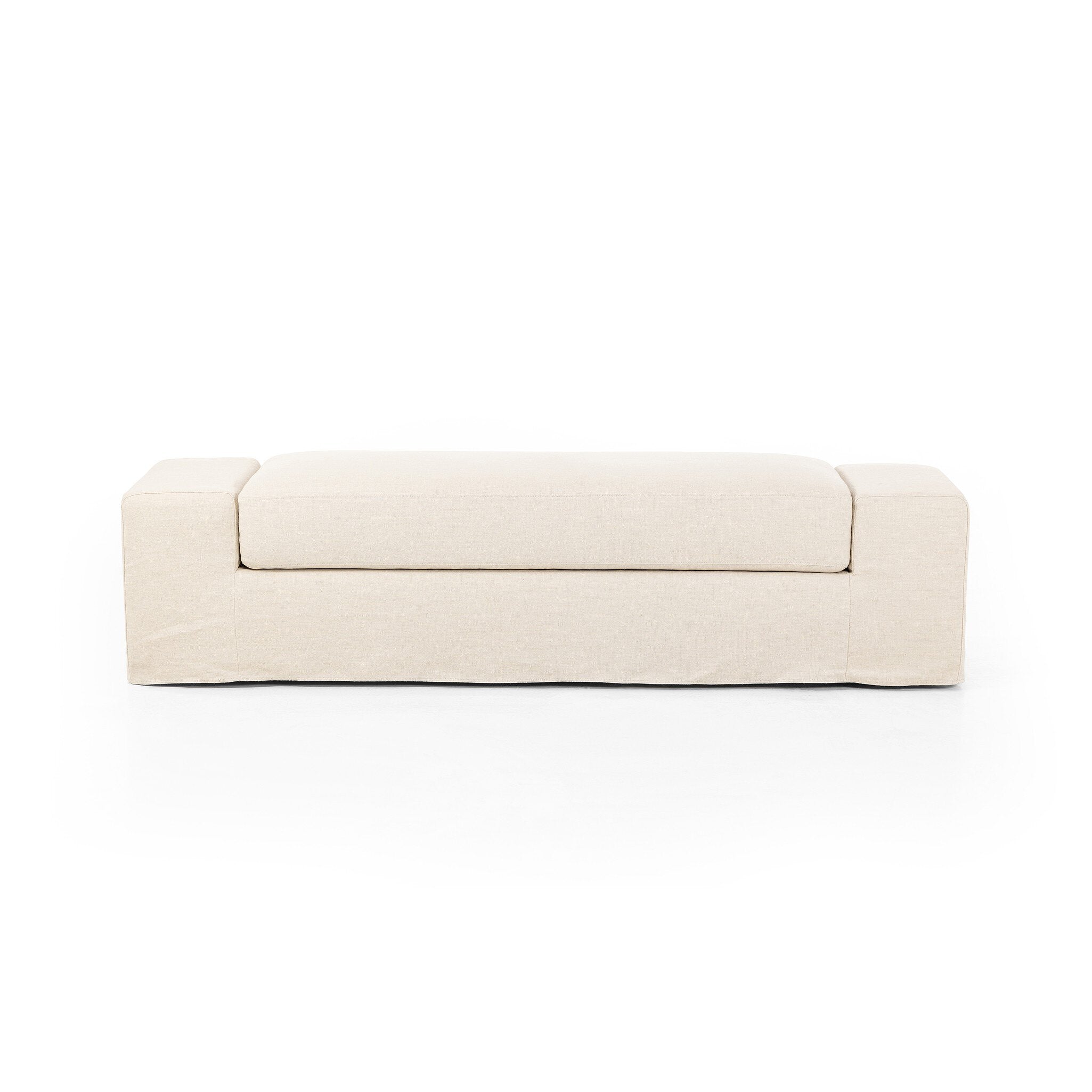 Ivory wide arm slipcover accent bench on a white background. 