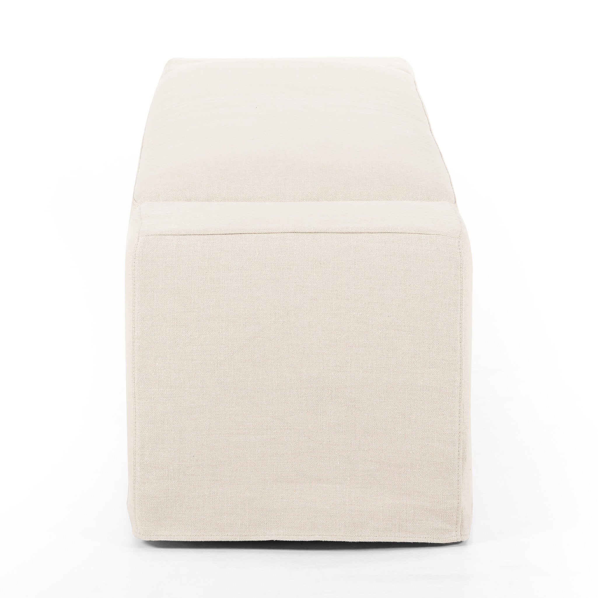 Ivory wide arm slipcover accent bench on a white background. 